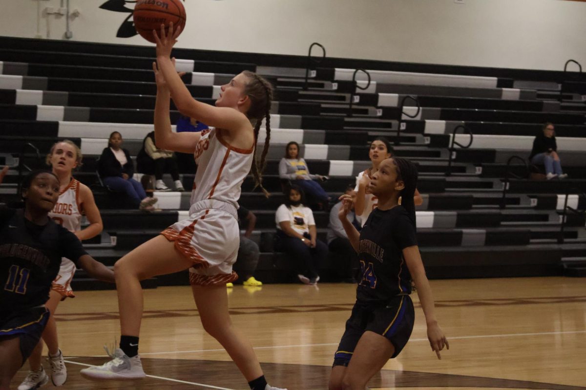 Taking the wide open layup Abby thailing '26 jumps up with no defenders in front of her. The Lady Warriors have worked on upcourt passes and good offensive looks this season. 