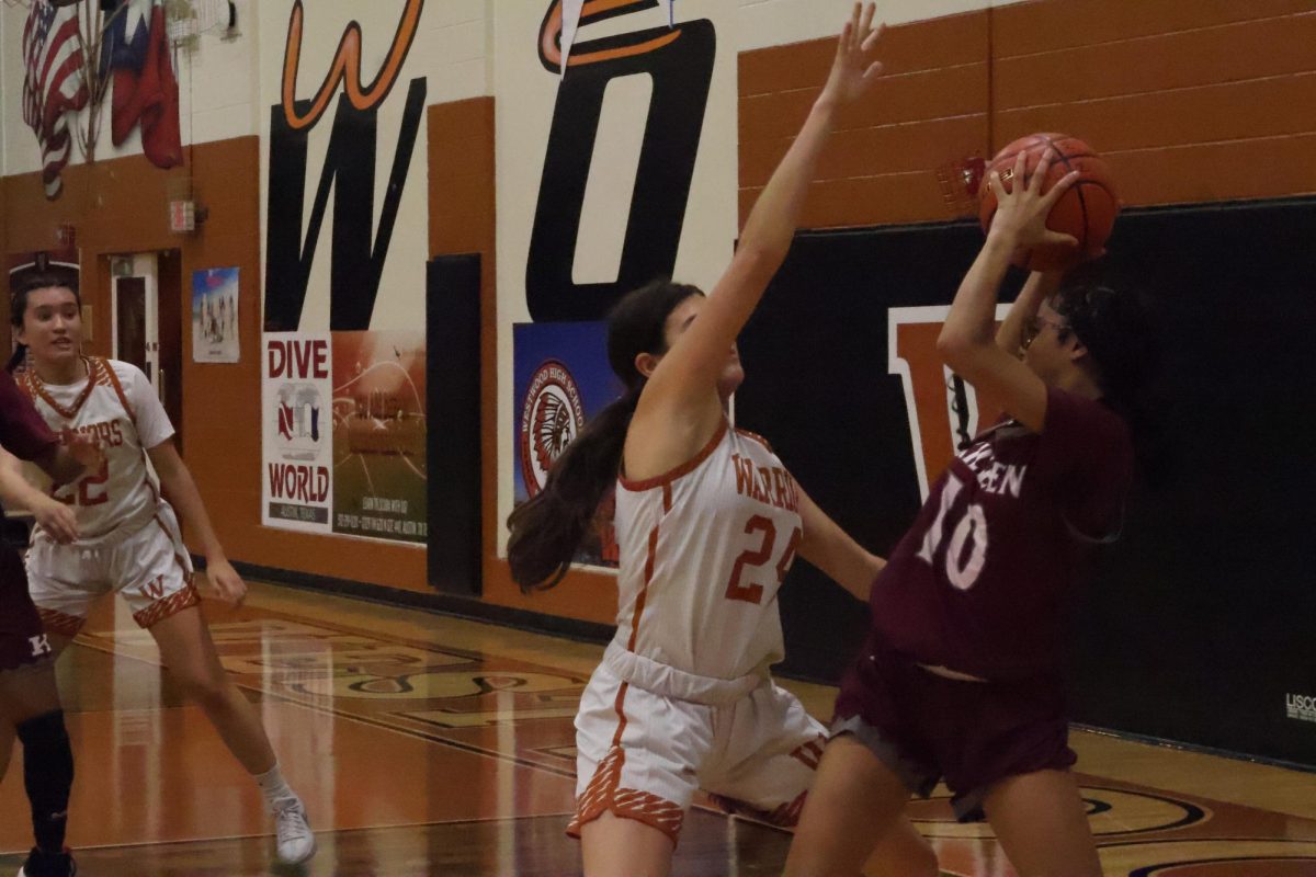 Lola Valentina '26 traps the opponent in the corner while playing tight defense. The Warriors shut the Kangaroos down for the most part only allowing 51 points. 