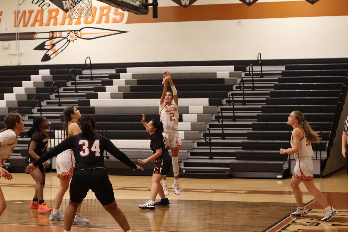 Firing from the 3-point line, Hadyn Espinoza' 26 flicks her wrist and aims for the basket. With no defense on her, Espinoza took a shot at the attempt of putting her team up in points. 