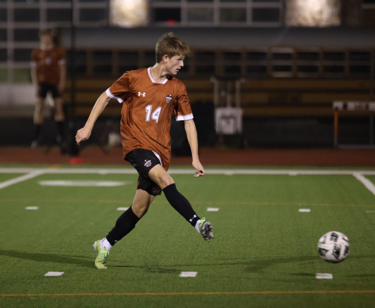 Jack Cox ‘26 makes direct eye contact with an open teammate as he passes the ball. Throughout the game the varsity boys displayed a clear sense of trust in each other as their plays became more intricate. 