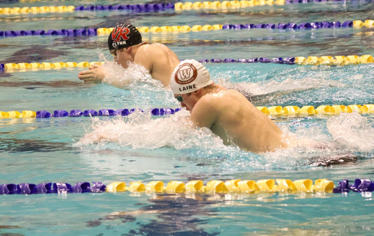 Tightening the gap between his opponents, Max Laine '27 lands in fourth place with a time of 56.95. From this swim, he became the fourth freshman in Westwood Swim and Dive history to qualify for State. 