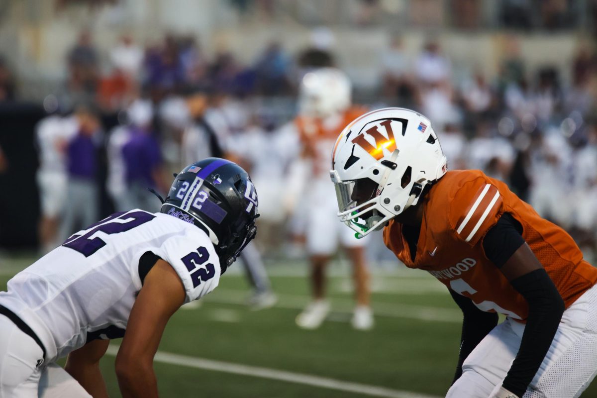 Eyes on his target, Dre Kyles '28 prepares to launch on the offensive player as the Raiders begin their play. While Warrior defense consistently slowed the Raiders down, the Raiders still managed sporadic touchdowns, eventually driving them to victory.