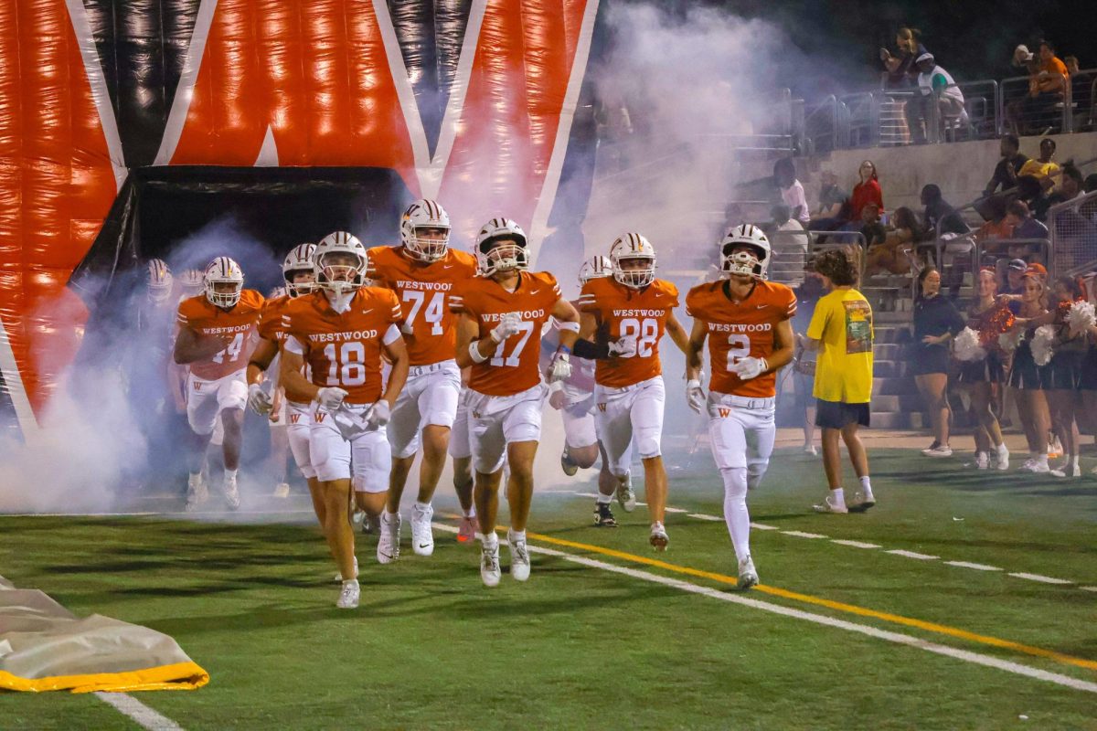 Bolting onto the field after halftime, juniors Ryan Edson and Canon Olofson lead the team continue fighting the Austin High Maroons. The Warriors came back with renewed energy and determination to fill in the gaps in offensive strategy.
