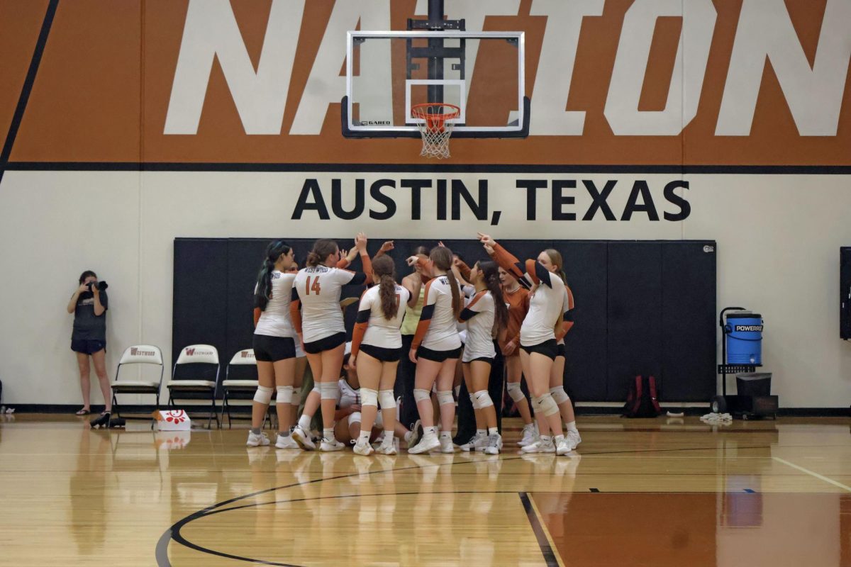 Putting their hands together, the Warriors stayed positive and determined during timeout despite losing the first set. Westwood's fiery energy helped to gain back points, but they could not secure the win against Round Rock.