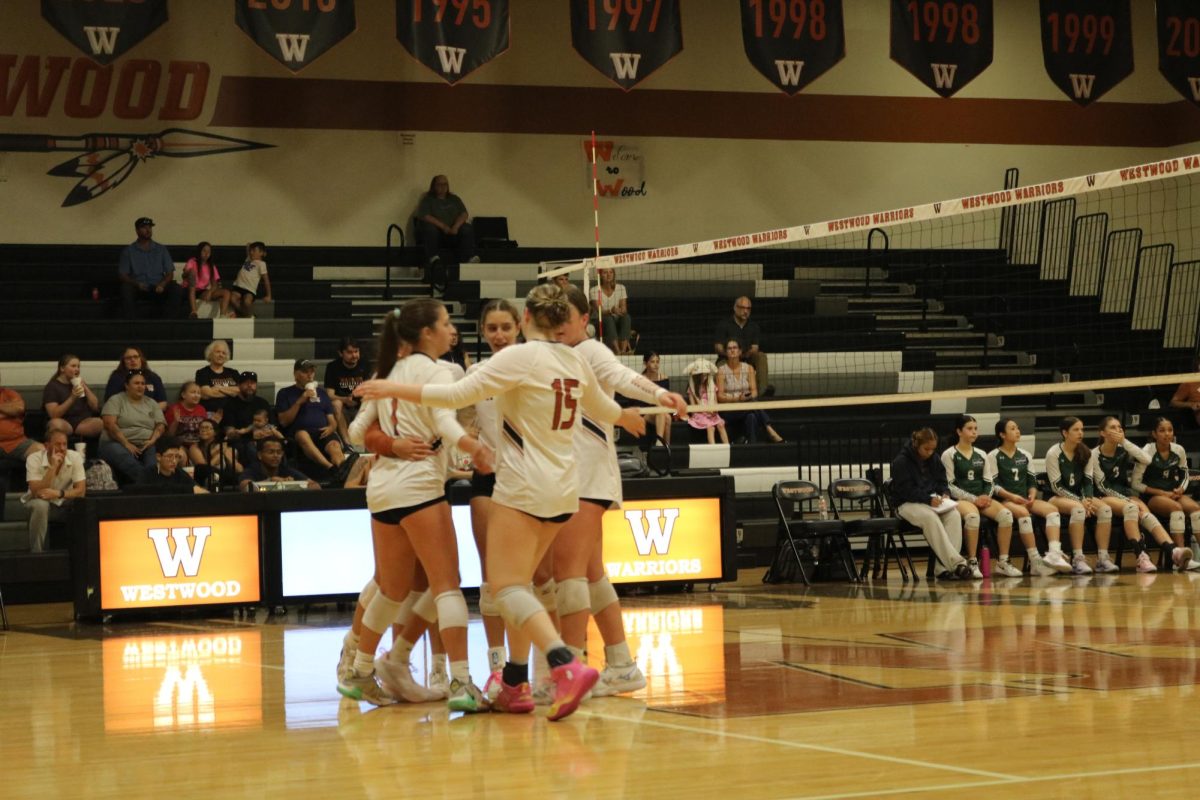 Celebrating the set, Lady Warriors gather together to enjoy the moment. The girls served hared balls and strategically got balls passed the McNeil defence, helping solidify set 1, 26-24. “I think in the first set, we were a lot more consistent in placing the ball and not just trying to score,” Quinn Ewert '28 said.
