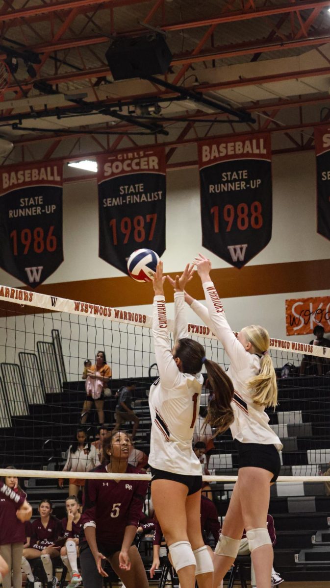 Jumping high, Lila Nicosia '28 and Quinn Ewert '28 shut down the Round Rock offence. The two girls played extremly crucail to the Warrior defence, stopping a lot of hard Round Rock offensive plays. "We've practiced a lot of defence leading up to this game," Ewert said. 