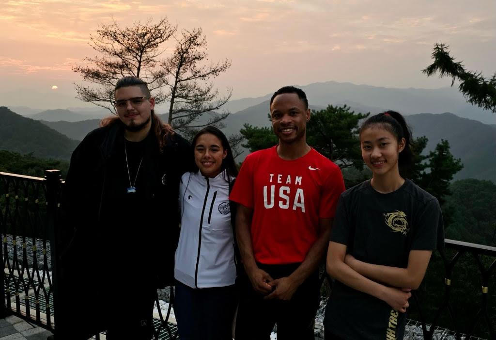 Alycia Chee '26 (right) poses for a picture with her taekwondo group. In August, Chee attended the Korea Open taekwondo competition in South Korea. "It’s a larger scale competition, [and] there were Olympians there," Chee said. "There were really good national teams, it was just a really cool experience, something you can’t find in the US." Photo courtesy of Alycia Chee