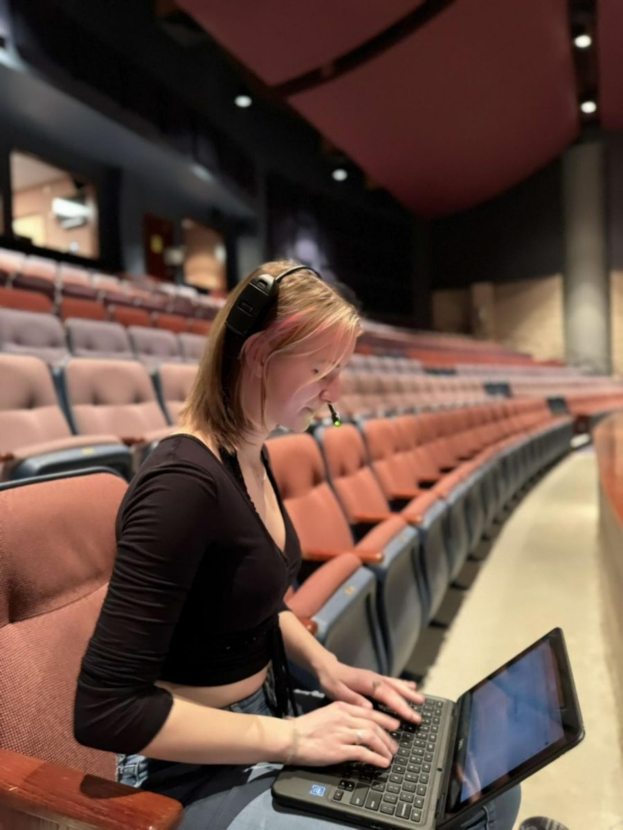 Hard at work, Assistant Director Ashley Jordan '24 stays on top of tasks at an evening rehearsal. A role within the theater program that is often overlooked, the assistant director is an integral part of every production. “So much goes into directing,” Jordan said. “Even [for the] musical, I feel like people don't think that I'm doing as much as I am. But a lot more goes into it than people think it does. ADs are putting a lot into the show, and I feel like that just goes unnoticed sometimes."