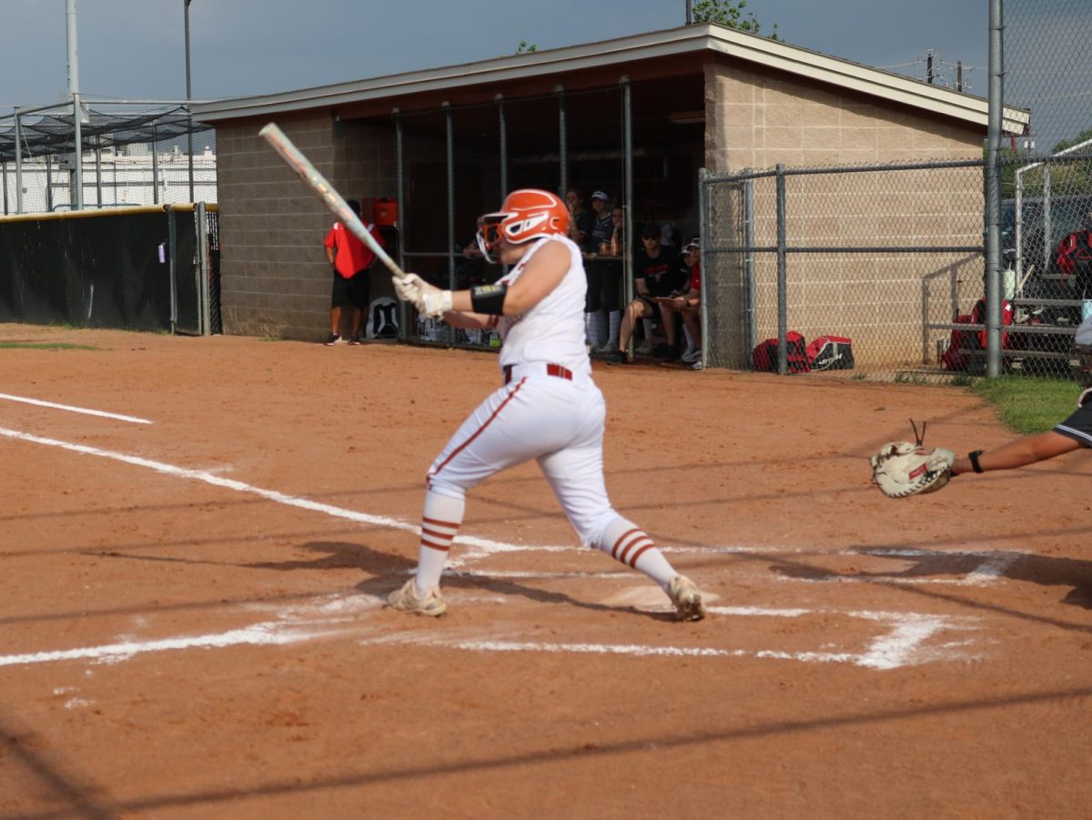 Emmy King '25 hits the ball gaining two bases.
