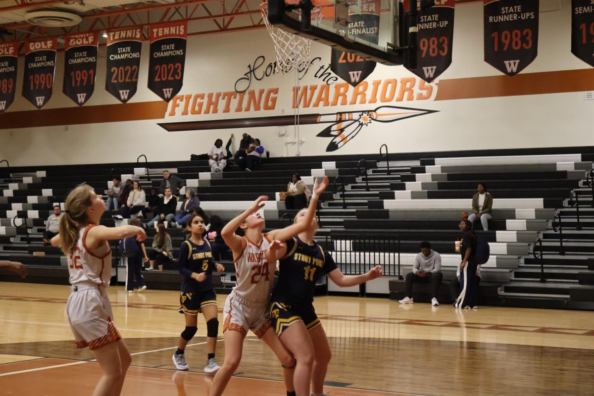 Lola Proana-Montana boxes out opponent player to try and snatch the rebound. Her fellow teammates waited close by, ready to grab the ball if it came their way. "I always try and be there ready for the rebound," Proana-Montana said.