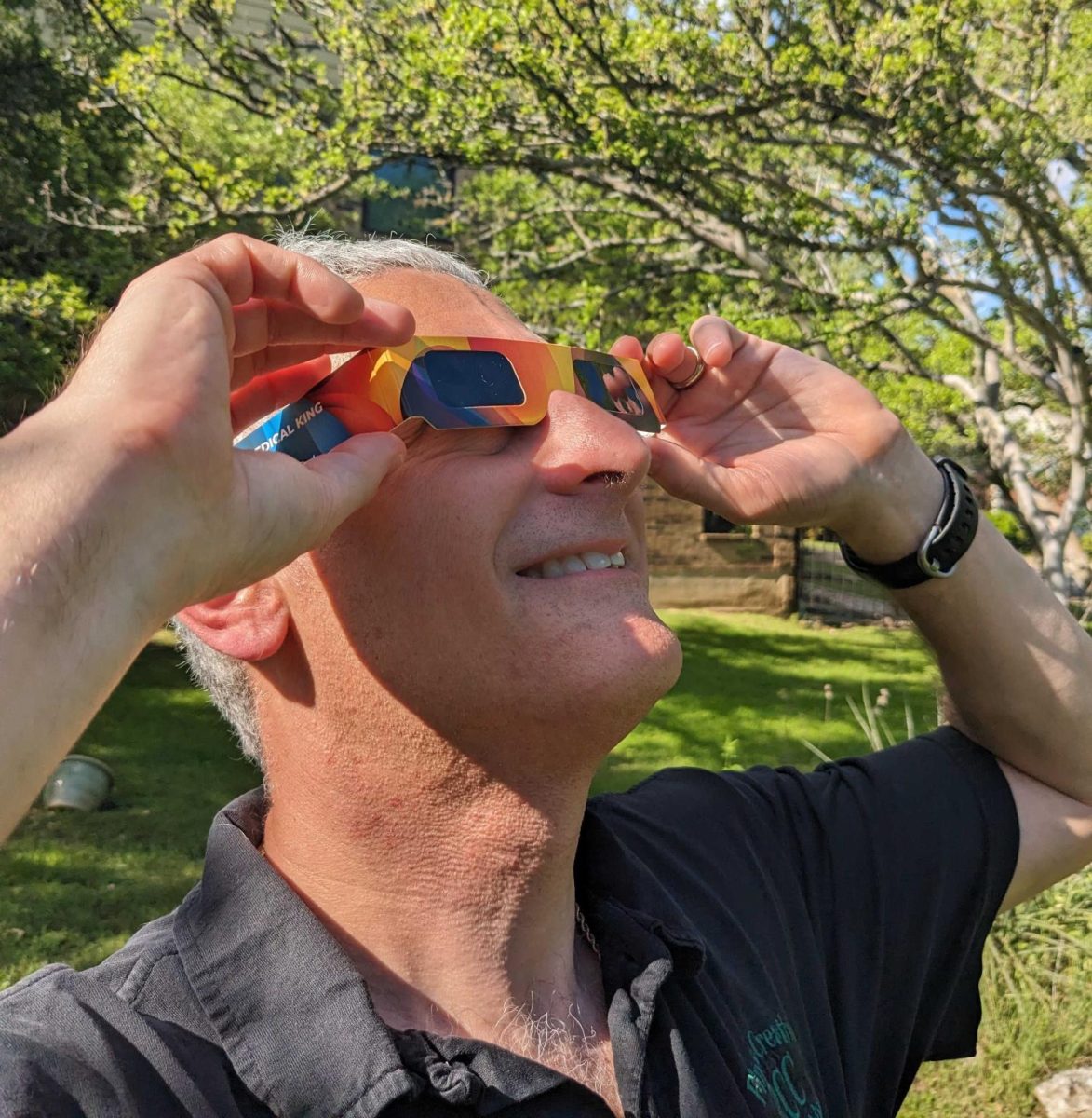 In preparation for the upcoming total solar eclipse, Austin resident Erik Schlanger practices using solar eclipse glasses. Those planning to observe the total eclipse have been encouraged to use these special shaded lenses to protect their eyesight from the sun's harsh rays.