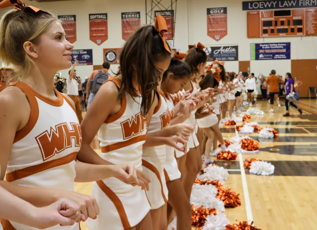 Singing the Alma Mater, the Cheer team brings the pep rally to a close. The cheer team performed a routine to a pop mash-up, and brought energy to the crowd.