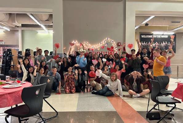 Posing for a photo, Valentine's Day Dance participants come together to celebrate the holiday. An annual district-wide dance, StuCo organized this event for students with special needs. 